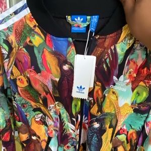 Medium Adidas multi color bird print jacket, never worn with tags still on